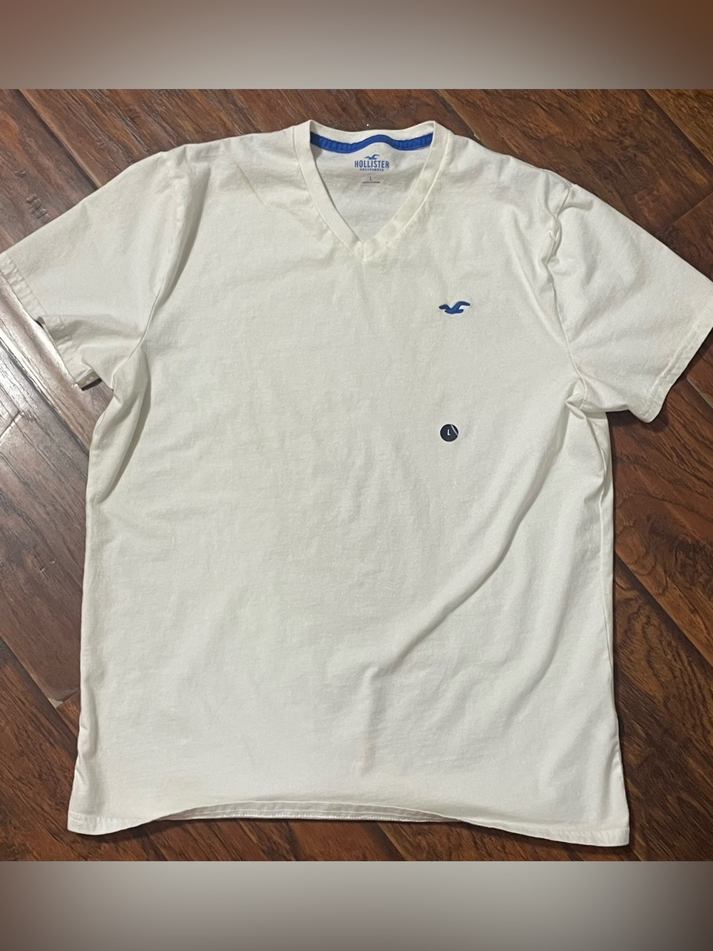 Hollister Men's V-Neck Tee in white with Blue Logo